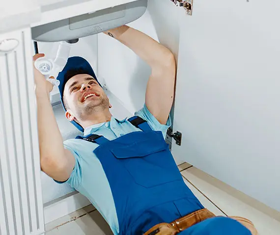 Professional plumber working